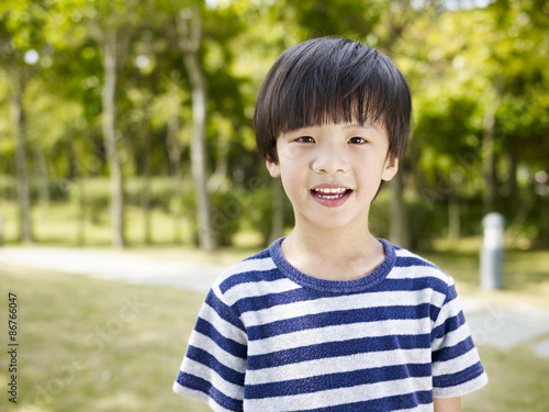 outdoor portrait of a little asian boy