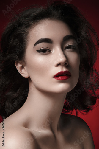 Wallpaper Mural Nice girl. Studio.Red Background. Beauty portrait. Torontodigital.ca