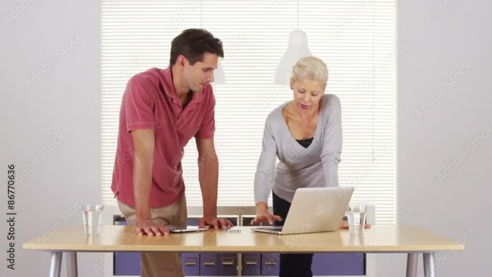 Business colleagues trying to figure out a solution to a problem Business colleagues trying to figure out a solution to a problem