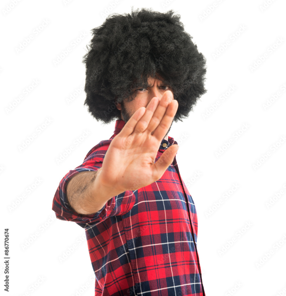 Afro man making stop sign Afro man making stop sign