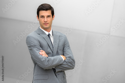 Attractive businessman portrait posing with successful expression CEO or head of company photo