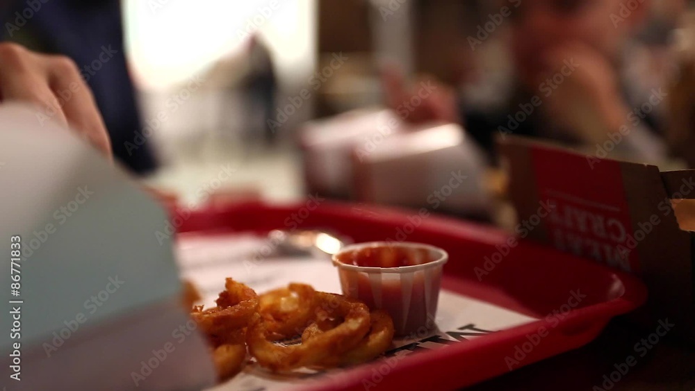 family eating french fries and fast food family eating french fries and fast food