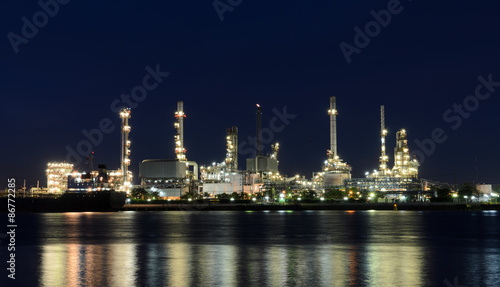 Oil refinery plant illuminated at night
