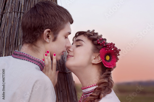 Young Ukrainian couple kissing photo