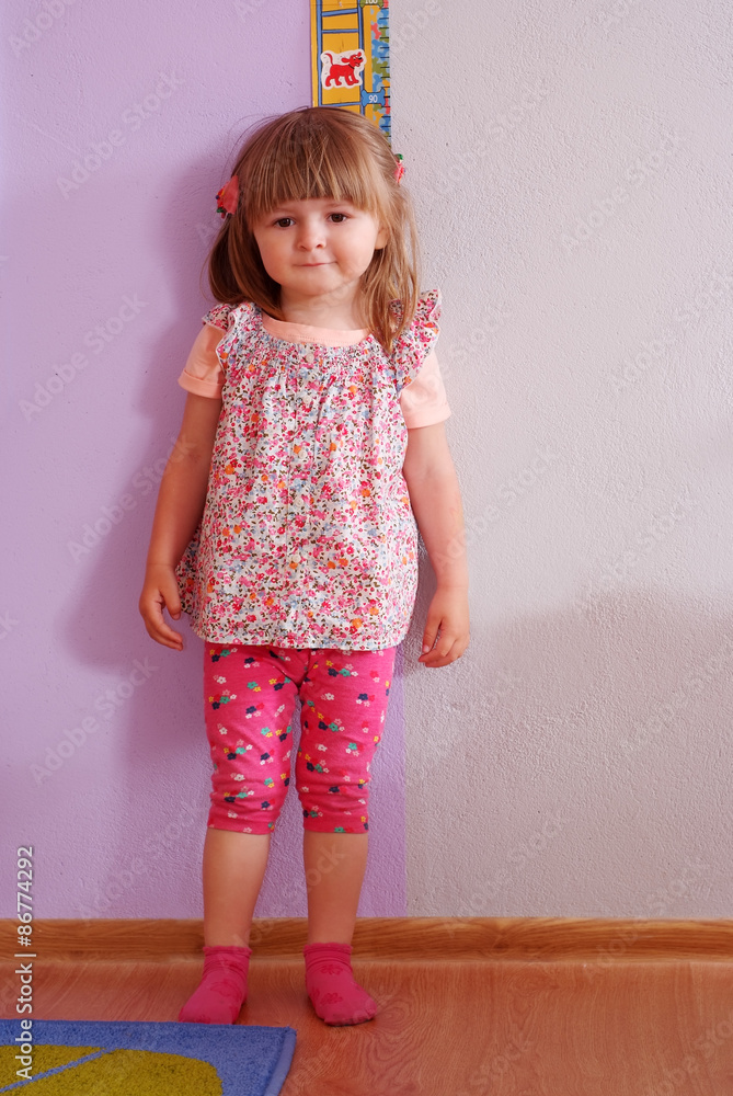 Two-year girl playing and learning in preschool Two-year girl playing and learning in preschool