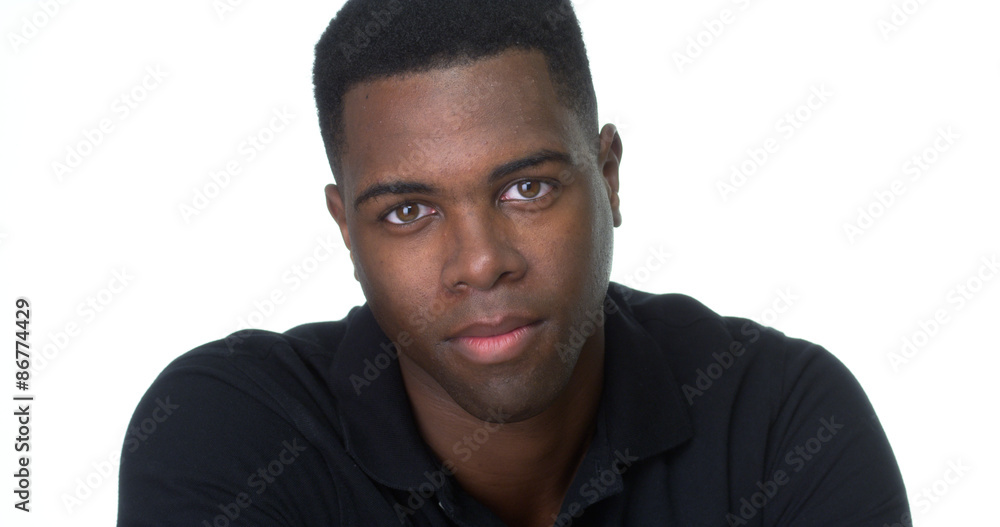 Close up of attractive young black man looking at camera Close up of attractive young black man looking at camera