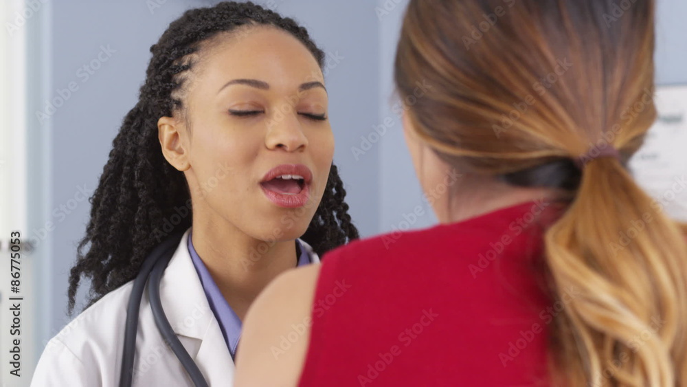 Close up of Black medical doctor having conversation with patient Close up of Black medical doctor having conversation with patient