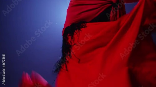 Closeup of flamenco dancer moving skirt