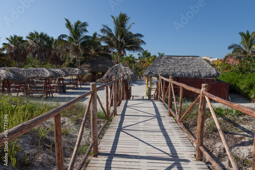 Path to Bar on the beach. Wooden bridge.