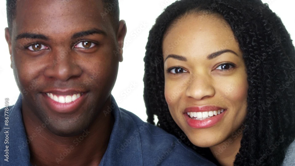 Young black couple smiling and looking at camera Young black couple smiling and looking at camera