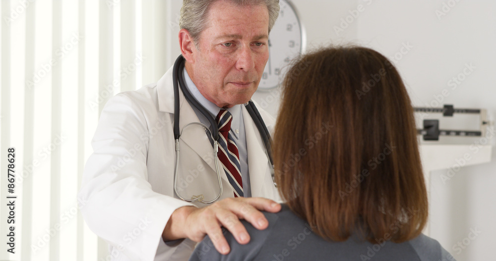 Doctor reassuring elderly patient of quick recovery Doctor reassuring elderly patient of quick recovery
