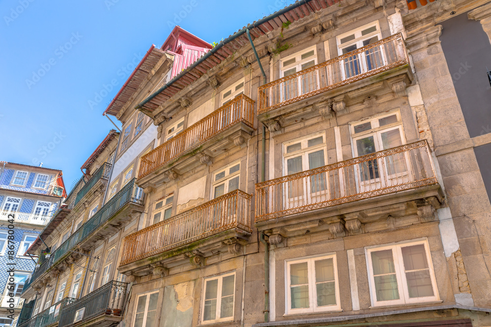 Old facade building in downtown Porto.