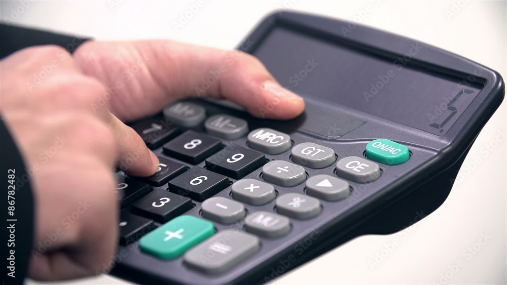 Businessman typing on calculator and showing results Businessman typing on calculator and showing results