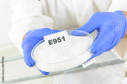 Photos Researcher holding sweetener E951