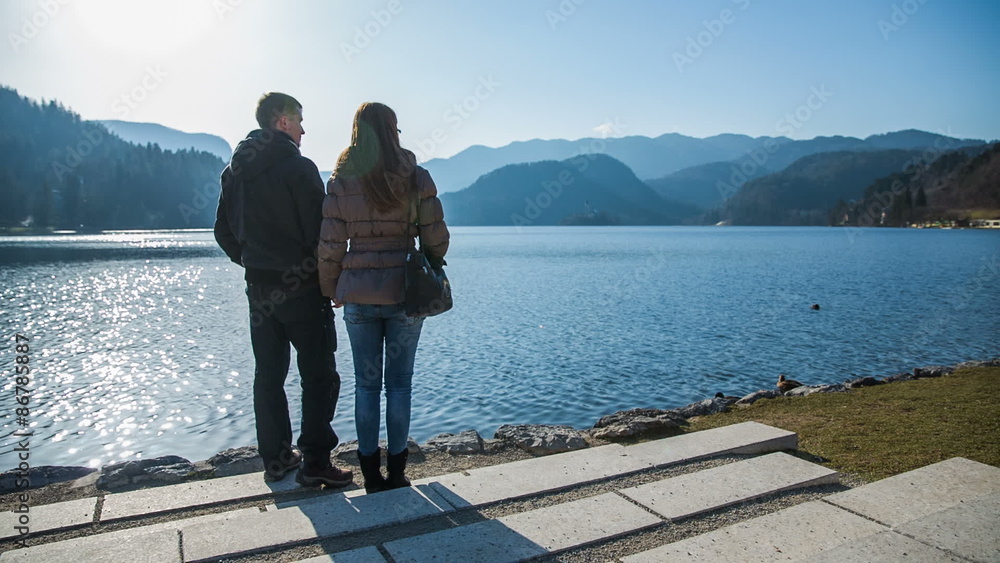 Two person enjoy lake Bled view on sunny day Two person enjoy lake Bled view on sunny day
