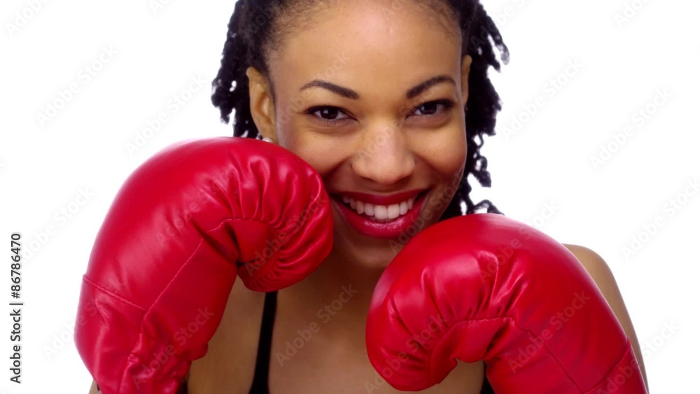 African woman wearing boxing gloves