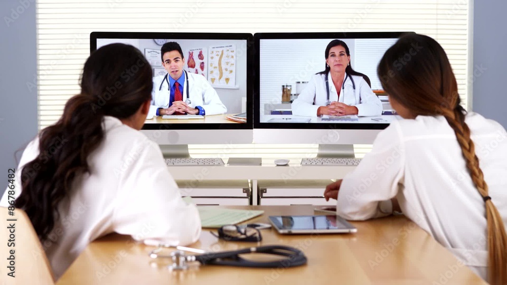 Professional team of diverse medical doctors having a video conference Professional team of diverse medical doctors having a video conference