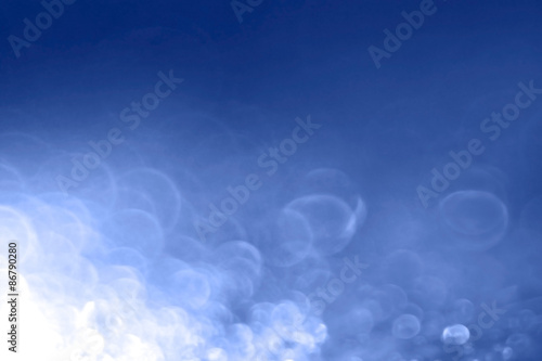 abstract concept blue background water drops glare bokeh