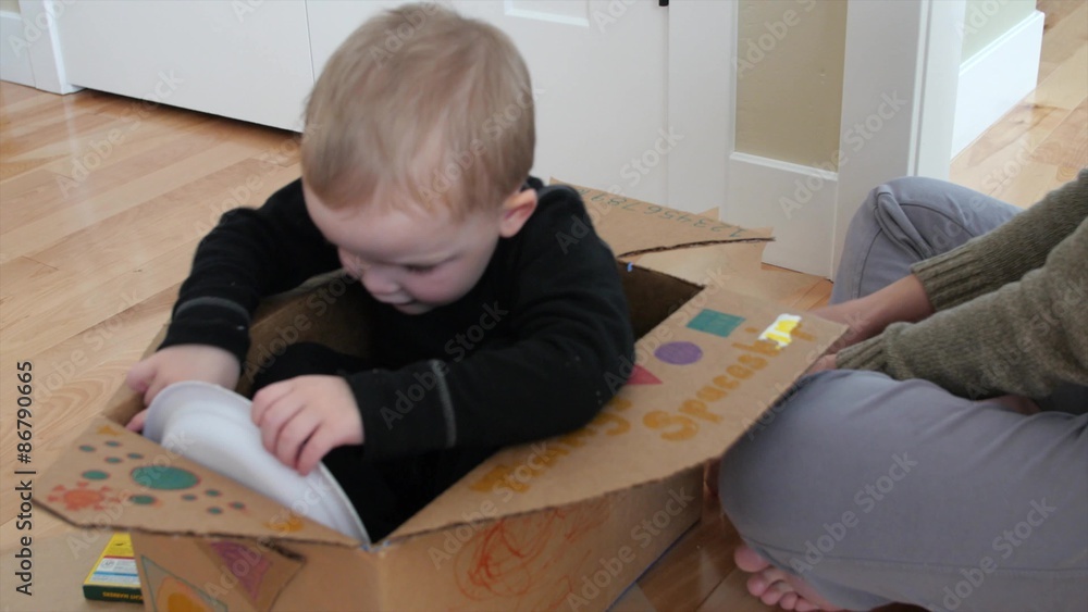 Mom making a spaceship with her toddler Mom making a spaceship with her toddler