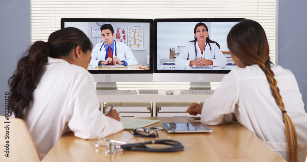 Mixed race team of medical doctors having a video conference Mixed race team of medical doctors having a video conference