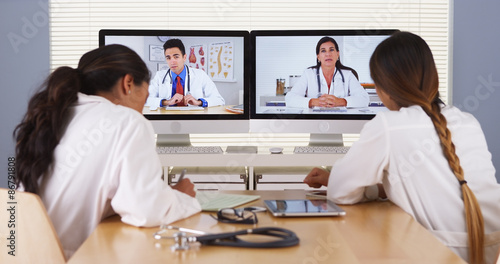 Mixed race team of medical doctors having a video conference