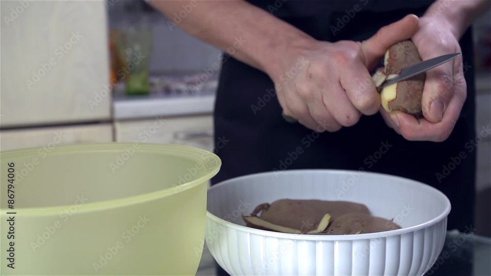 Zoom out Peeling Potato in Slow Motion Zoom out Peeling Potato in Slow Motion