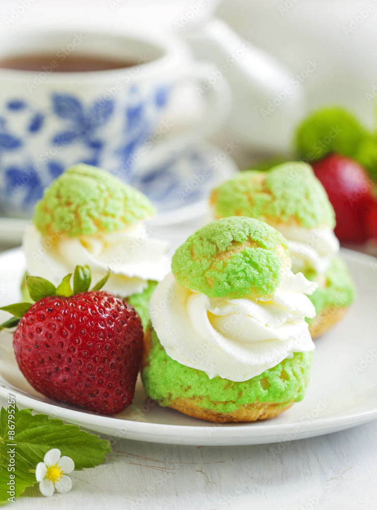 Profiteroles with strawberry compote and whipped cream. Profiteroles with strawberry compote and whipped cream.