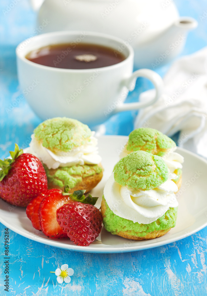 Profiteroles with strawberry compote and whipped cream. Profiteroles with strawberry compote and whipped cream.