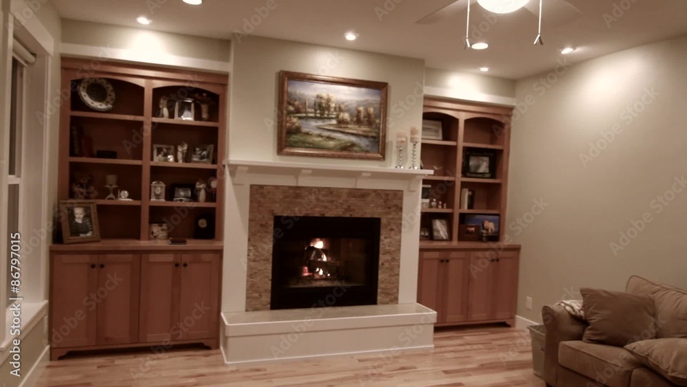 a roaring fireplace and sitting room jib shot a roaring fireplace and sitting room jib shot