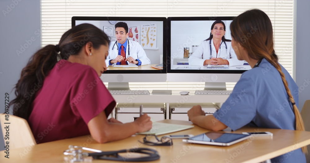 Group of diverse medical doctors video conferencing Group of diverse medical doctors video conferencing
