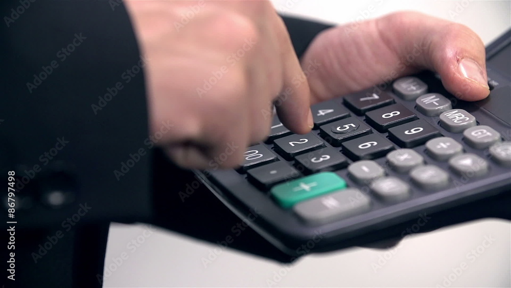 Close up on businessman fingers calculating Close up on businessman fingers calculating