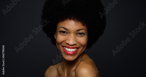 Sultry African woman wearing elegant white gown