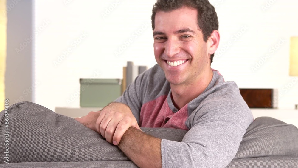 Happy guy lying on couch Happy guy lying on couch