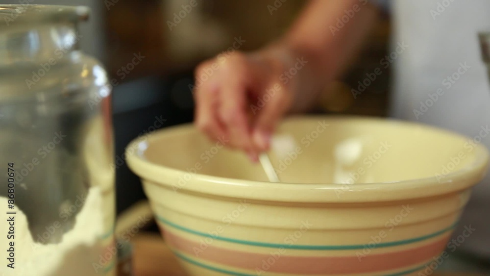 a woman puts yeast in beer bread dough a woman puts yeast in beer bread dough