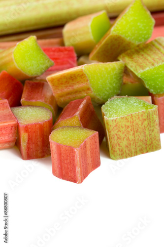 freshly cut pieces of rhubarb isolated on white background