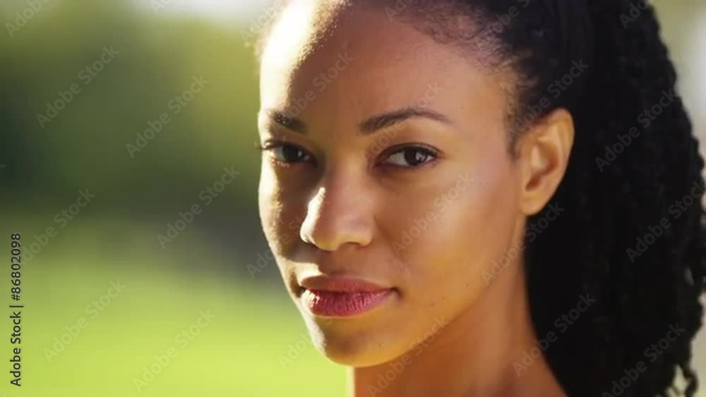 Portrait of African woman smiling in a park Portrait of African woman smiling in a park