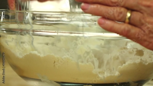 mixing butter into a pie crust photo