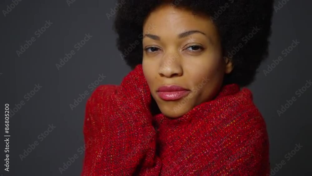 Black woman with afro wearing red shawl Black woman with afro wearing red shawl