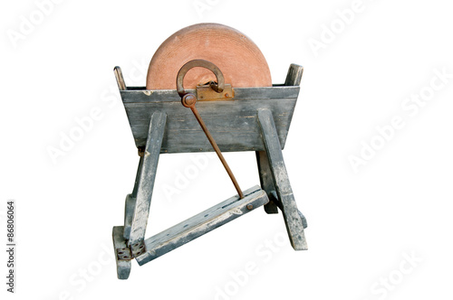 Ancient grindstone on a white background.