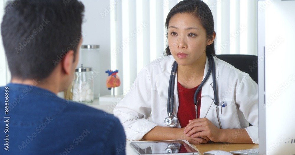 Chinese doctor explaining xray to patient Chinese doctor explaining xray to patient