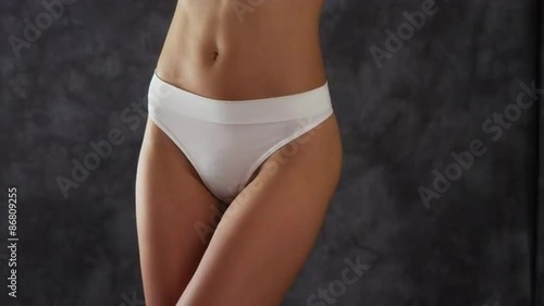 Attractive Chinese woman wearing a white thong