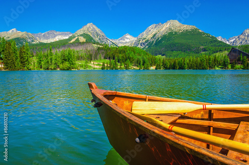 Wooden boat on a beautiful mountain lake
