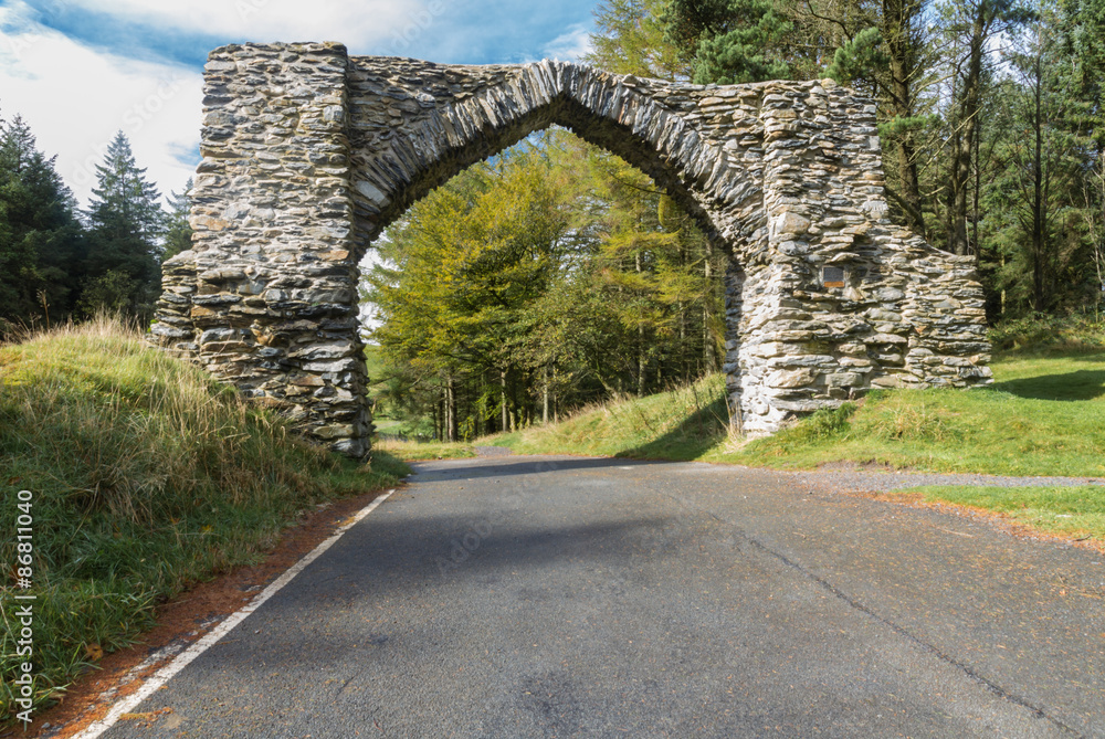 The Jubilee Arch, old graceful stone archway over minor road.