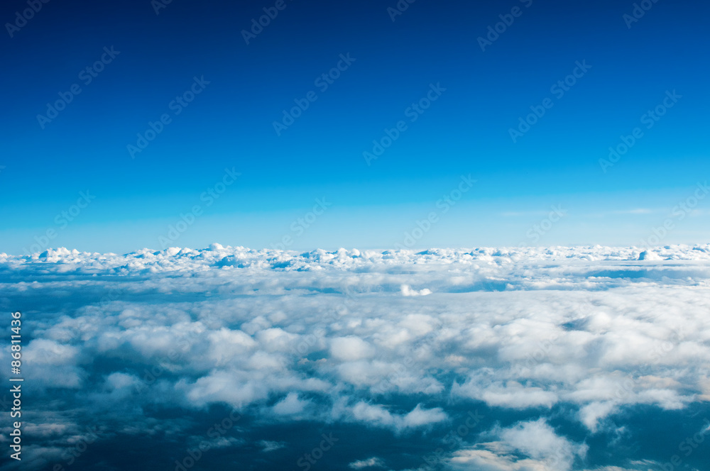 View of white clouds from plane