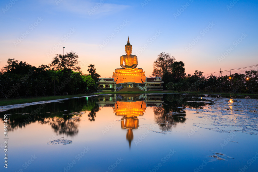 Big Buddha statue on sunset sky with reflection,Thailand
