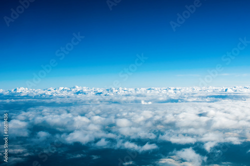 View of white clouds from plane photo