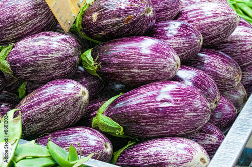 Ripe eggplants on stall