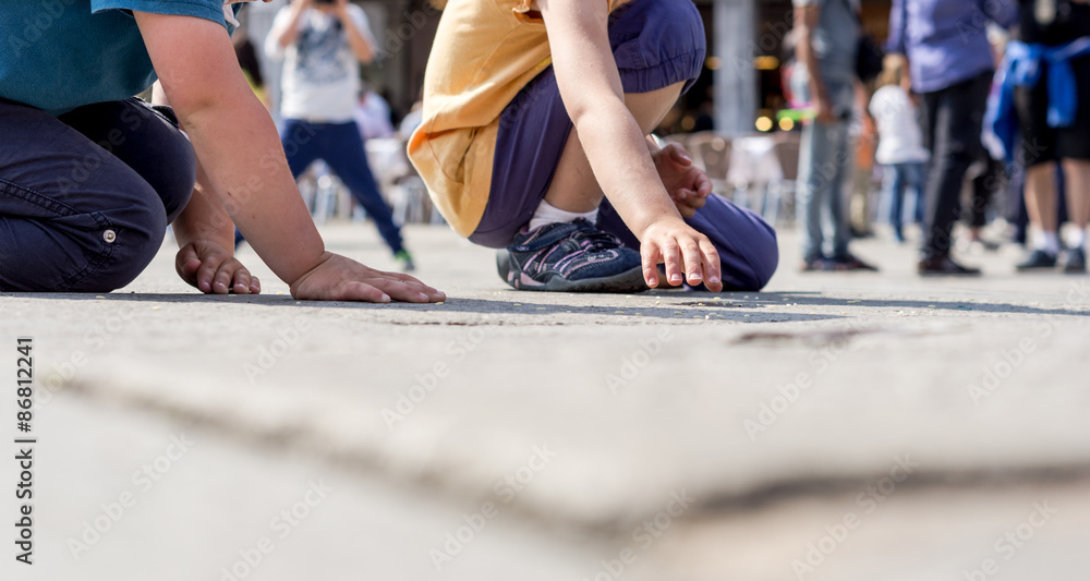 two children are playing on the floor - lifestyle concept two children are playing on the floor - lifestyle concept