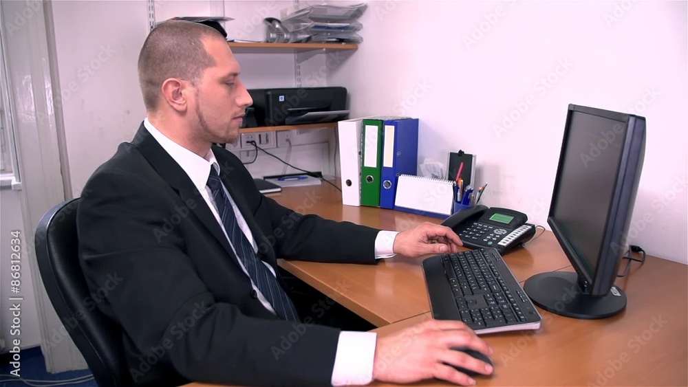 Business Man In Office Picking Up Telephone Business Man In Office Picking Up Telephone