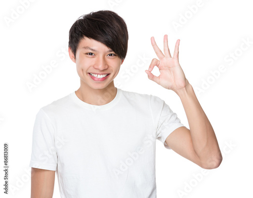 Wallpaper Mural Asian young man with ok sign gesture Torontodigital.ca